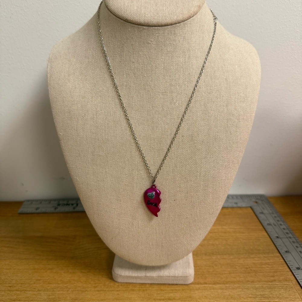 Half of pink magnetic best friends necklace